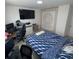 Spacious bedroom with Versace-themed wall and gaming setup at 2737 Nottel Dr, Saint Cloud, FL 34772