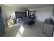 Main bedroom with large bed and tufted headboard at 2737 Nottel Dr, Saint Cloud, FL 34772