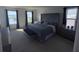 Main bedroom with large bed, water view, and plenty of natural light at 2737 Nottel Dr, Saint Cloud, FL 34772