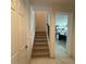 Staircase view with access to upper floor and living area at 2737 Nottel Dr, Saint Cloud, FL 34772