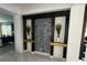 Contemporary entryway showcasing a circular-patterned wall accent and sleek design at 2737 Nottel Dr, Saint Cloud, FL 34772