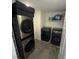 Laundry room with washer, dryer, and shelving at 2737 Nottel Dr, Saint Cloud, FL 34772