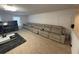 Game room with long reclining sectional sofa and arcade games at 2737 Nottel Dr, Saint Cloud, FL 34772