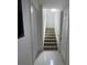 Bright stairwell with white walls and marble flooring at 2737 Nottel Dr, Saint Cloud, FL 34772
