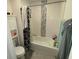 Bathroom with tub, shower, and decorative tile at 2737 Nottel Dr, Saint Cloud, FL 34772