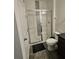 Bathroom with a large walk-in shower and gray tile flooring at 2737 Nottel Dr, Saint Cloud, FL 34772