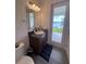 Bathroom with lake view and direct backyard access at 2737 Nottel Dr, Saint Cloud, FL 34772