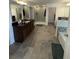 Large bathroom with double vanity, shower, and patterned tile at 2737 Nottel Dr, Saint Cloud, FL 34772