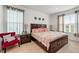 Spacious bedroom with king-size bed and ensuite bathroom at 3878 Carrick Bend Dr, Kissimmee, FL 34746