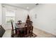 Small dining room with dark wood table and four chairs at 3878 Carrick Bend Dr, Kissimmee, FL 34746