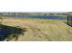 Large backyard with lake view and mature landscaping at 445 Via Abruzzi St, Poinciana, FL 34759