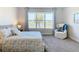 Bedroom with lake view and comfy armchair at 445 Via Abruzzi St, Poinciana, FL 34759