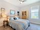 Bedroom with wooden cabinet, window, and ceiling fan at 445 Via Abruzzi St, Poinciana, FL 34759