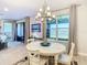 Bright dining room with view of water feature at 445 Via Abruzzi St, Poinciana, FL 34759