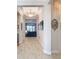 Bright entry hall with tile flooring and views into the living room at 445 Via Abruzzi St, Poinciana, FL 34759