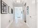 Light-filled hallway with neutral walls and wood-look tile floor at 445 Via Abruzzi St, Poinciana, FL 34759