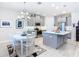 Open concept kitchen with island and breakfast nook at 445 Via Abruzzi St, Poinciana, FL 34759
