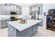 Modern kitchen with gray cabinets, quartz countertops, and stainless steel appliances at 445 Via Abruzzi St, Poinciana, FL 34759