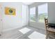 Bright home office with wood chair and large windows at 445 Via Abruzzi St, Poinciana, FL 34759