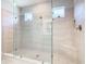 Large walk-in shower with glass enclosure, built-in seat, and dual shower heads at 445 Via Abruzzi St, Poinciana, FL 34759