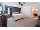 Spacious main bedroom with a king-size bed and en-suite bathroom at 502 Pentas Ln, Haines City, FL 33844