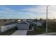 Aerial view of a single-Gathering home with a two-car garage and a well-maintained lawn at 502 Pentas Ln, Haines City, FL 33844