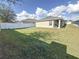 Spacious backyard with a large grassy area and privacy fence at 502 Pentas Ln, Haines City, FL 33844