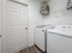 Bright laundry room with washer, dryer, and ample storage at 502 Pentas Ln, Haines City, FL 33844
