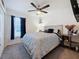 Cozy bedroom with a ceiling fan, a queen-sized bed, and gray carpeting at 502 Pentas Ln, Haines City, FL 33844