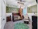 bedroom with a crib, armchair, and jungle-themed decor at 502 Pentas Ln, Haines City, FL 33844