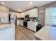Modern kitchen with white cabinets and stainless steel appliances at 502 Pentas Ln, Haines City, FL 33844