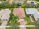 Property's bird's eye view showing house, landscaping, and neighborhood context at 141 Marabella Loop, Poinciana, FL 34759