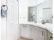Bathroom features a corner vanity with storage and a modern sink at 141 Marabella Loop, Poinciana, FL 34759