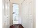 A small bathroom with toilet and sink, conveniently located near bedrooms at 141 Marabella Loop, Poinciana, FL 34759