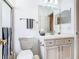 Bright bathroom with vanity, toilet, and shower stall at 141 Marabella Loop, Poinciana, FL 34759