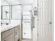 Updated bathroom with a walk-in shower and grab bars at 141 Marabella Loop, Poinciana, FL 34759