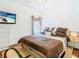 Spacious bedroom with a king-size bed and private access to a balcony at 141 Marabella Loop, Poinciana, FL 34759
