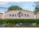 Solvita community entrance sign with landscaping at 141 Marabella Loop, Poinciana, FL 34759