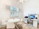 Home office and dining area with white table and chairs at 141 Marabella Loop, Poinciana, FL 34759