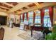 Lobby with piano, seating, and community boards at 141 Marabella Loop, Poinciana, FL 34759