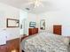 Main bedroom with hardwood floors and sliding glass doors at 141 Marabella Loop, Poinciana, FL 34759