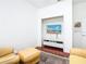 Cozy media room featuring comfortable seating and built-in entertainment center at 141 Marabella Loop, Poinciana, FL 34759