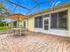 Spacious screened patio perfect for outdoor dining and relaxation at 141 Marabella Loop, Poinciana, FL 34759