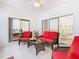 Sunroom with seating area and views to the backyard at 141 Marabella Loop, Poinciana, FL 34759