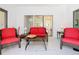 Spacious sunroom with comfortable seating and views of backyard at 141 Marabella Loop, Poinciana, FL 34759