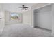 Bright bedroom with window, ceiling fan, and carpet flooring at 2108 Lemon St, Haines City, FL 33844