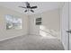 Bright bedroom with carpet flooring, large window, and double door closet at 2108 Lemon St, Haines City, FL 33844