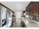 Modern kitchen with granite countertops and dark wood cabinets at 2108 Lemon St, Haines City, FL 33844