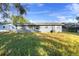 Home's backyard with a large grassy area at 2108 Lemon St, Haines City, FL 33844