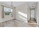 Bright dining room with hardwood floors and a window providing natural light at 2108 Lemon St, Haines City, FL 33844
